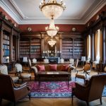 A grand library with vintage furniture and elegant decor, showcasing timeless classic pieces